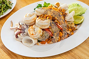 Delicious seafood thai fried rice (crab meat, shrimp, crab roe and squid