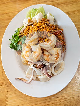 Delicious seafood thai fried rice (crab meat, shrimp, crab roe and squid