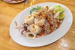 Delicious seafood thai fried rice (crab meat, shrimp, crab roe and squid