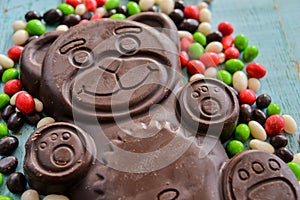 Delicious seasonal Sweets: chocolate figure bears and a lot of candy. The concept of Easter sweets.