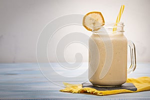 Delicious shake in cup with slices of fruit