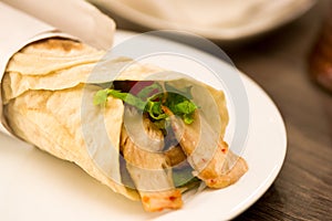 Delicious shawarma rolled sandwich with meat and vegetables