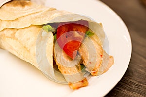 Delicious shawarma rolled sandwich with meat and vegetables