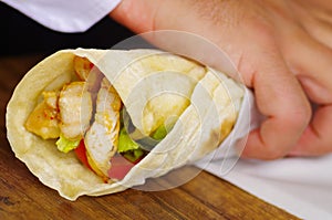 Delicious shawarma rolled sandwich with meat and vegetables