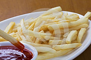 Delicious shoestring style french fries with ketchup