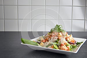 Delicious shrimp ceasar salad on a plate