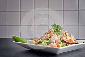 Delicious shrimp ceasar salad on a plate