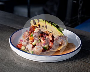 Delicious shrimp, fish and octopus tostada Mexican style