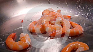 Delicious Shrimps fall on a heated vegetable oil