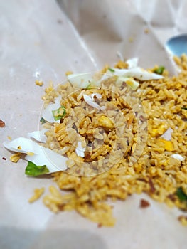 delicious and simple egg fried rice wrapped in greaseproof paper photo