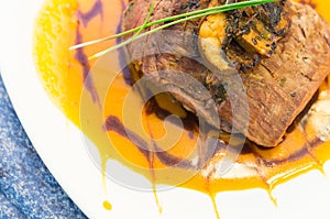 Delicious sirloin steak placed upon a bed of curry