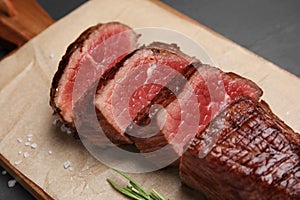 Delicious sliced beef tenderloin on table