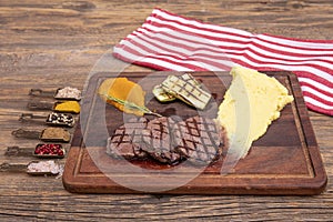 Delicious sliced beef tenderloin on table, closeup. Sirloin steak