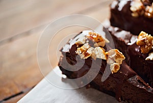 Delicious slices of nutty chocolate cake sitting on a table