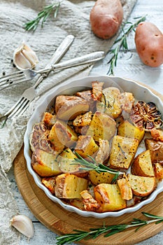 Delicious slices of roasted potatoes with rosemary.