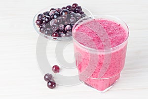 Delicious smoothie with black currant on the table