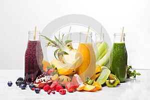 The delicious smoothies with exotic fruits on a white background