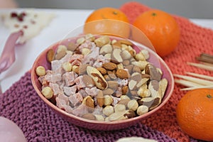 delicious snack nuts dried fruits and tangerines on the table sweets good presentation healthy self-care treats for