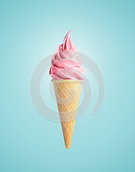 Delicious soft serve berry ice cream in crispy cone on pastel light blue background