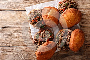 Delicious South African Vetkoek fried donuts stuffed with minced