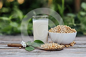 Delicious soy milk on wooden table background