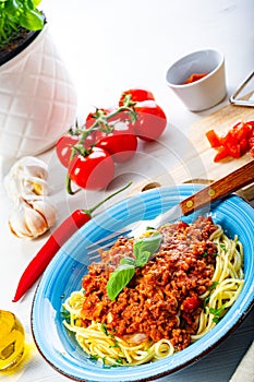 Delicious spaghetti bolognese on white background