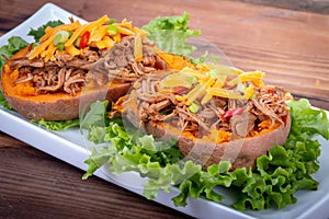 Delicious spicy pulled pork stuffed sweet potato dish