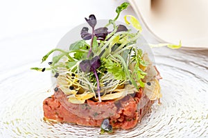 Delicious starter, veal tenderloin fillet tartar and garden salad