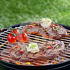 Delicious steak grilling on a barbecue