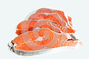 Delicious steaks of salmon fish after freezing before cooking in a restaurant or kitchen. Wholesome food and diet