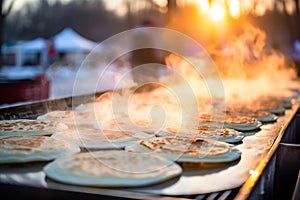 Delicious steamy pancakes on a snowy morning with the sun shining brightly in winter