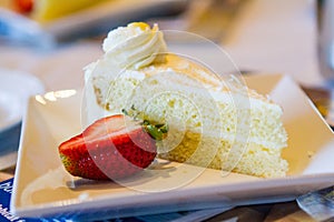 Delicious Strawberry Cake on a White Plate