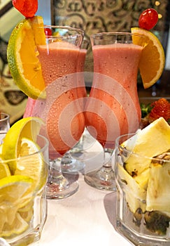 Delicious strawberry drink with condensed milk and vodka with lemon and cashew pineapple effects