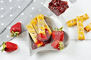 Delicious strawberry fruit and jam and puff pastry stick photo