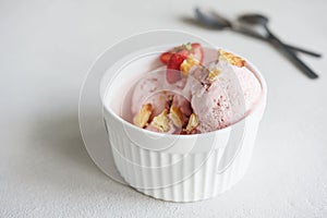 Delicious Strawberry Ice Cream with fresh strawberries and cookies in a bowl