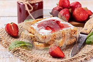 Delicious strawberry jam on toast bread