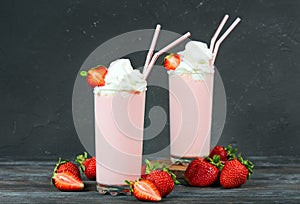 Delicious strawberry milkshake decorated with whipped cream