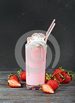 Delicious strawberry milkshake decorated with whipped cream