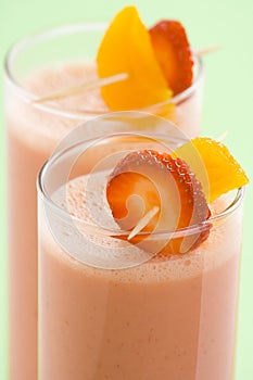 Delicious strawberry orange banana milkshake