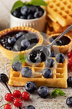 Delicious summer snacks - blueberry jam, tarte and waffle sweets