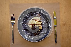 Delicious sweet banana split ice cream dessert with garnishment of chocolate syrup