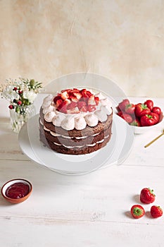 Delicious and sweet cake with strawberries and baiser on a plate photo