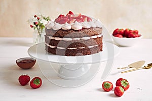 Delicious and sweet cake with strawberries and baiser on a plate photo