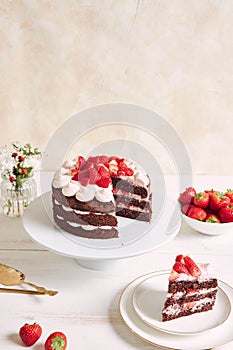 Delicious and sweet cake with strawberries and baiser on a plate photo