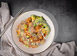 Delicious sweet chopping chicken rice, sesame seeds, sliced spring onions, broccoli, and vegetables. Asian food, Japanese food.