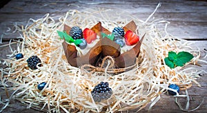Delicious, sweet cupcakes decorated with cream, chocolate cream, cinnamon, cocoa.decorated with fresh, natural, organic fruit, sug