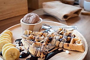 Delicious sweet dessert : homemade waffle with chocolate sauce