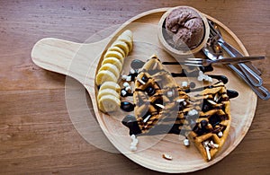 Delicious sweet dessert : homemade waffle with chocolate sauce ,