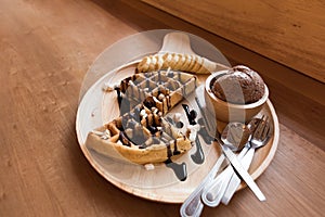 Delicious sweet dessert : homemade waffle with chocolate sauce ,