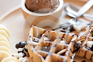 Delicious sweet dessert : homemade waffle with chocolate sauce ,